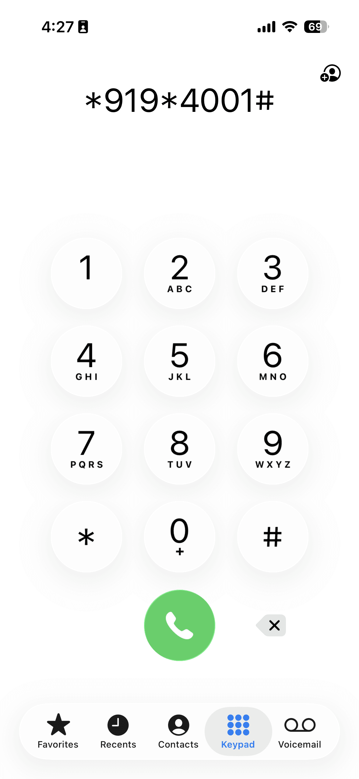Attendant dialing the Pump IQ USSD short code on a smartphone